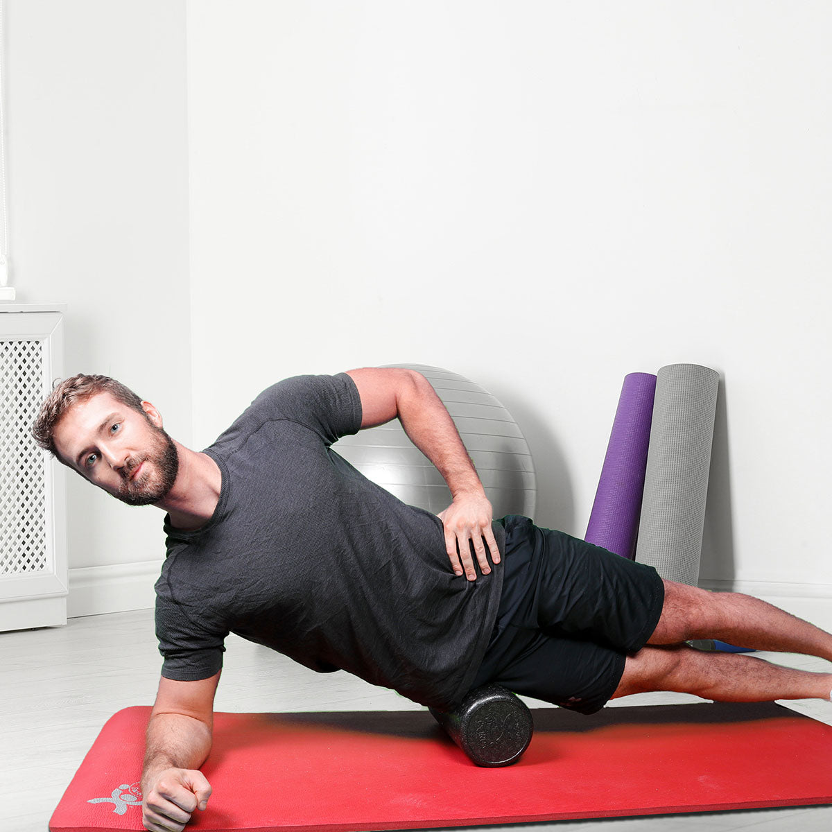 CanDo Foam Roller - Black Composite - Extra Firm - 6" x 18" - Round