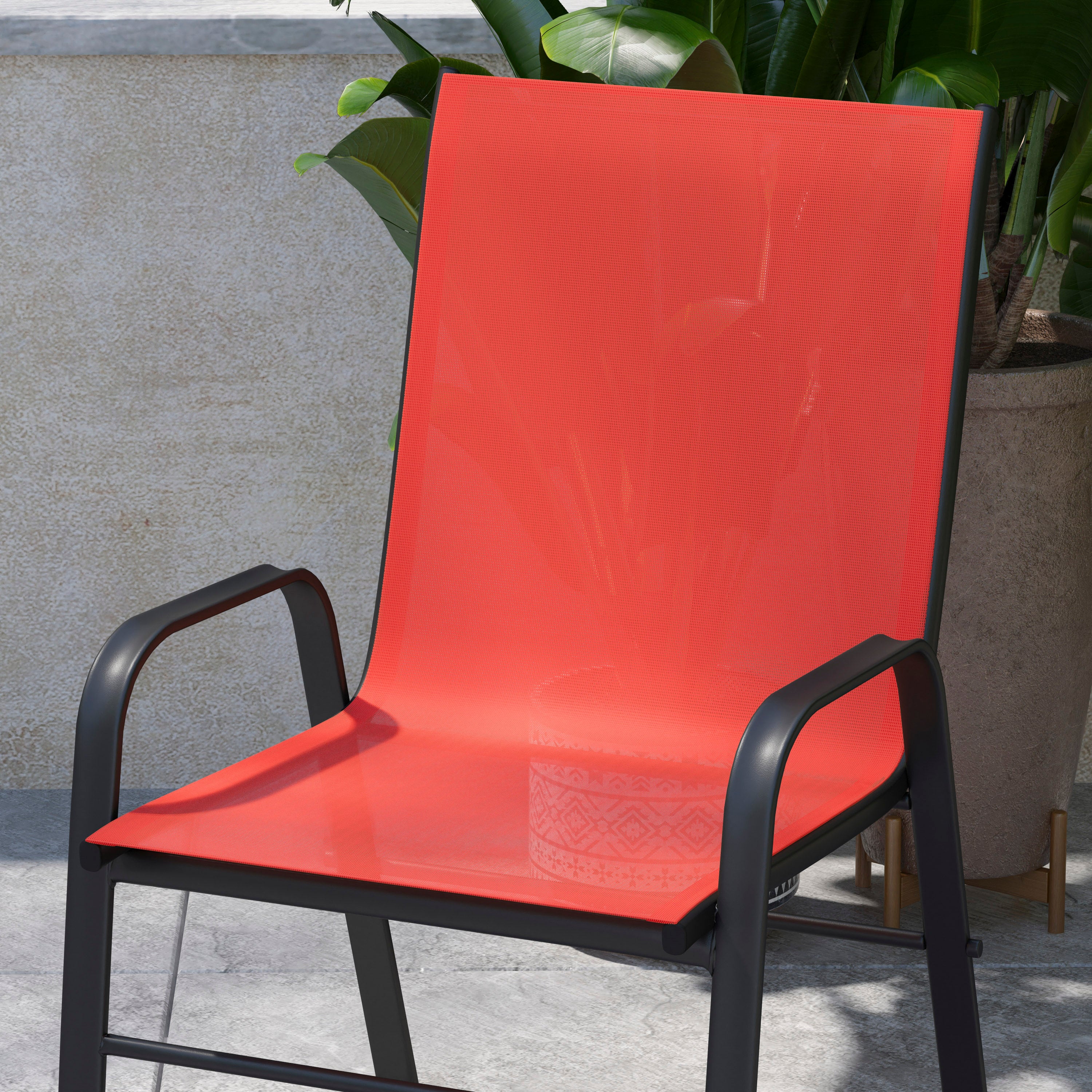 4 Pack Brazos Series Black Outdoor Stack Chair with Flex Comfort Material and Metal Frame