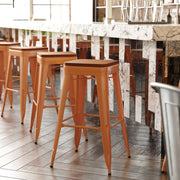 Kai Commercial Grade 30" High Backless Orange Metal Indoor-Outdoor Barstool with Teak Poly Resin Wood Seat