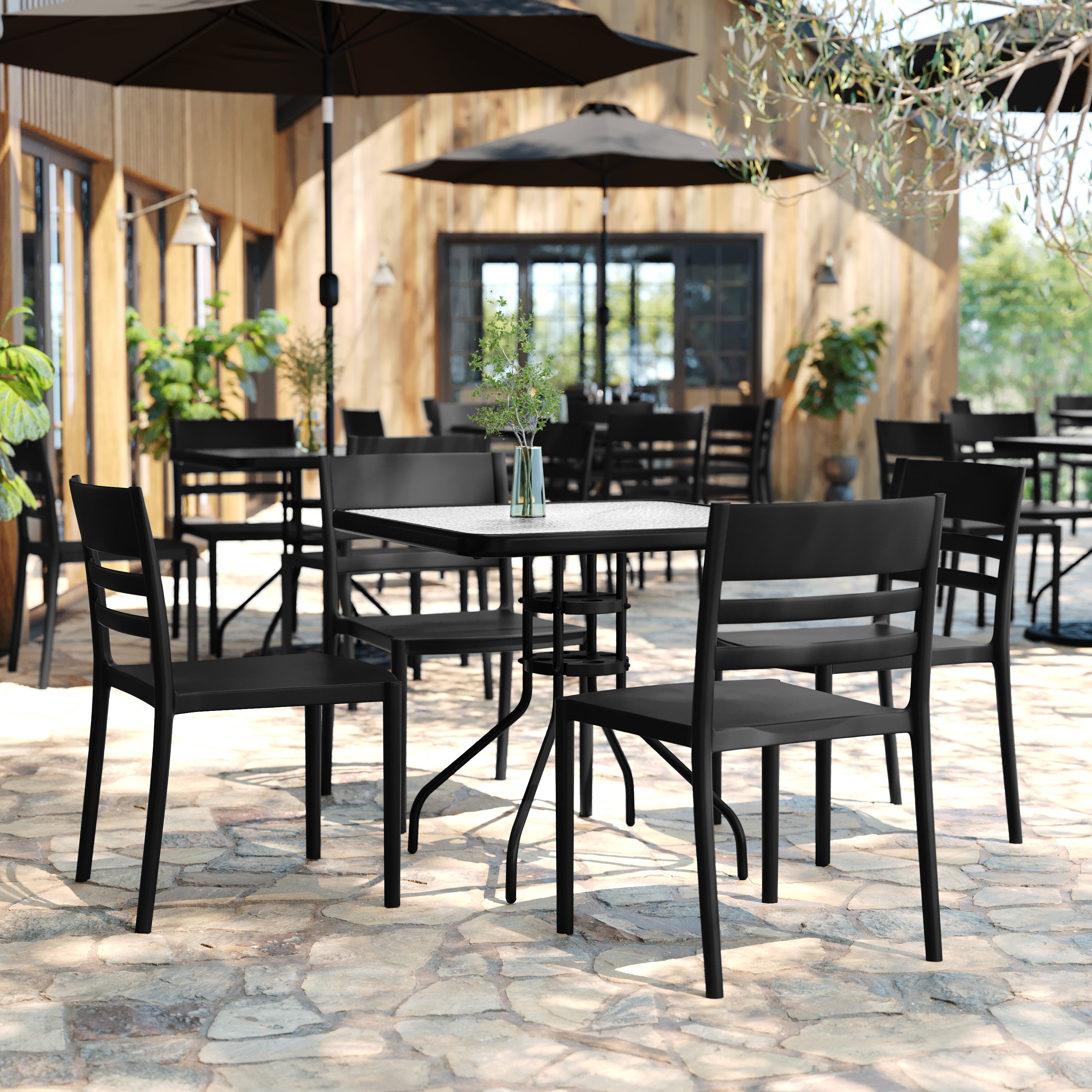 Bridgeport Indoor-Outdoor Stacking Patio Chair with Slatted Backrest, Commercial All-Weather Resin Chair in Black