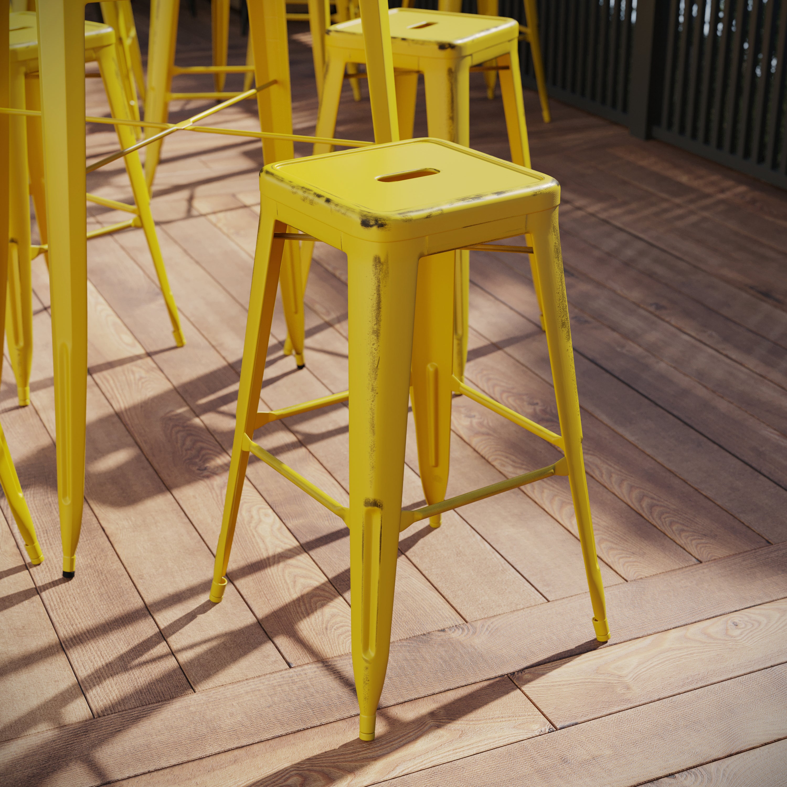 Kai Commercial Grade 30" High Backless Distressed Yellow Metal Indoor-Outdoor Barstool