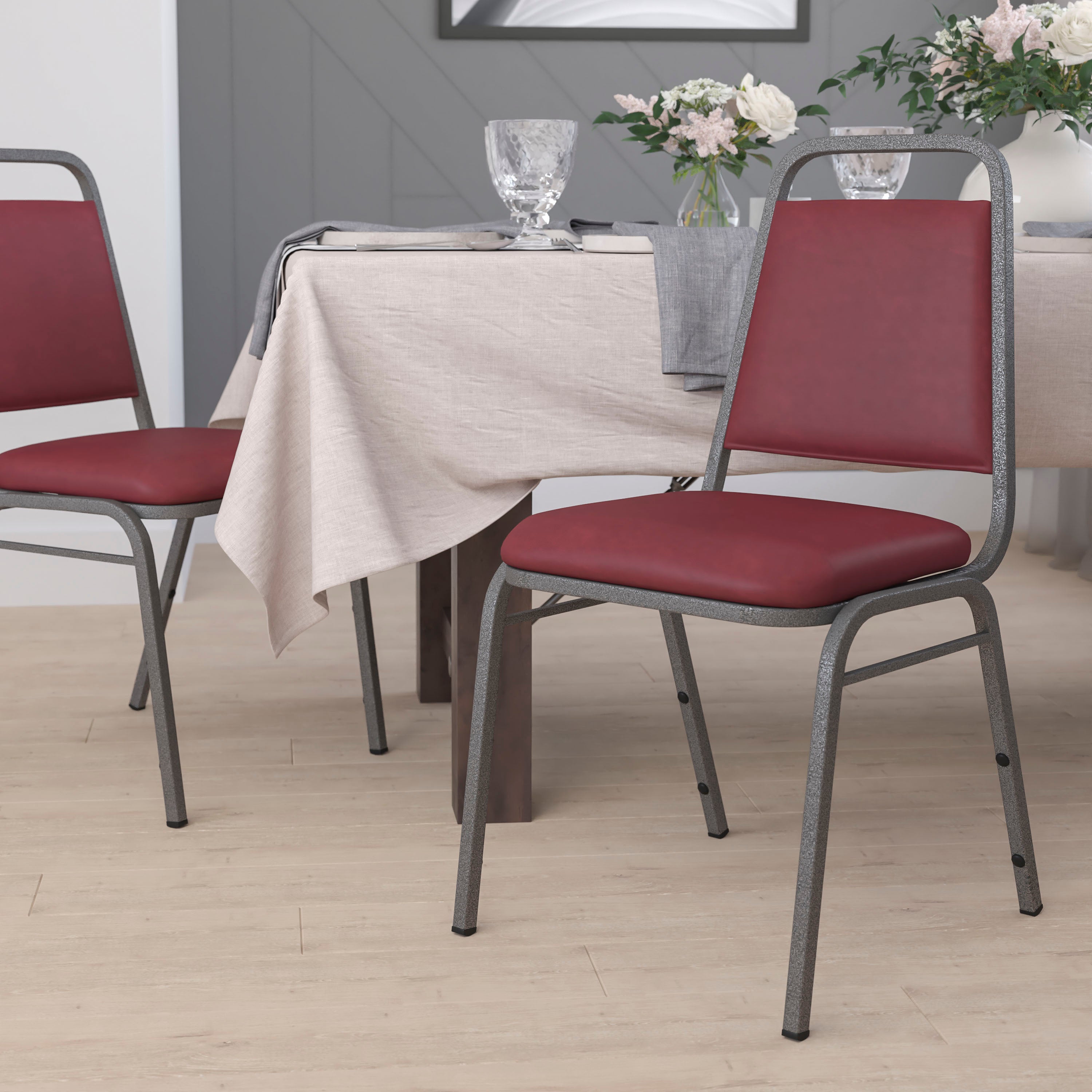 HERCULES Series Trapezoidal Back Stacking Banquet Chair in Burgundy Vinyl - Silver Vein Frame