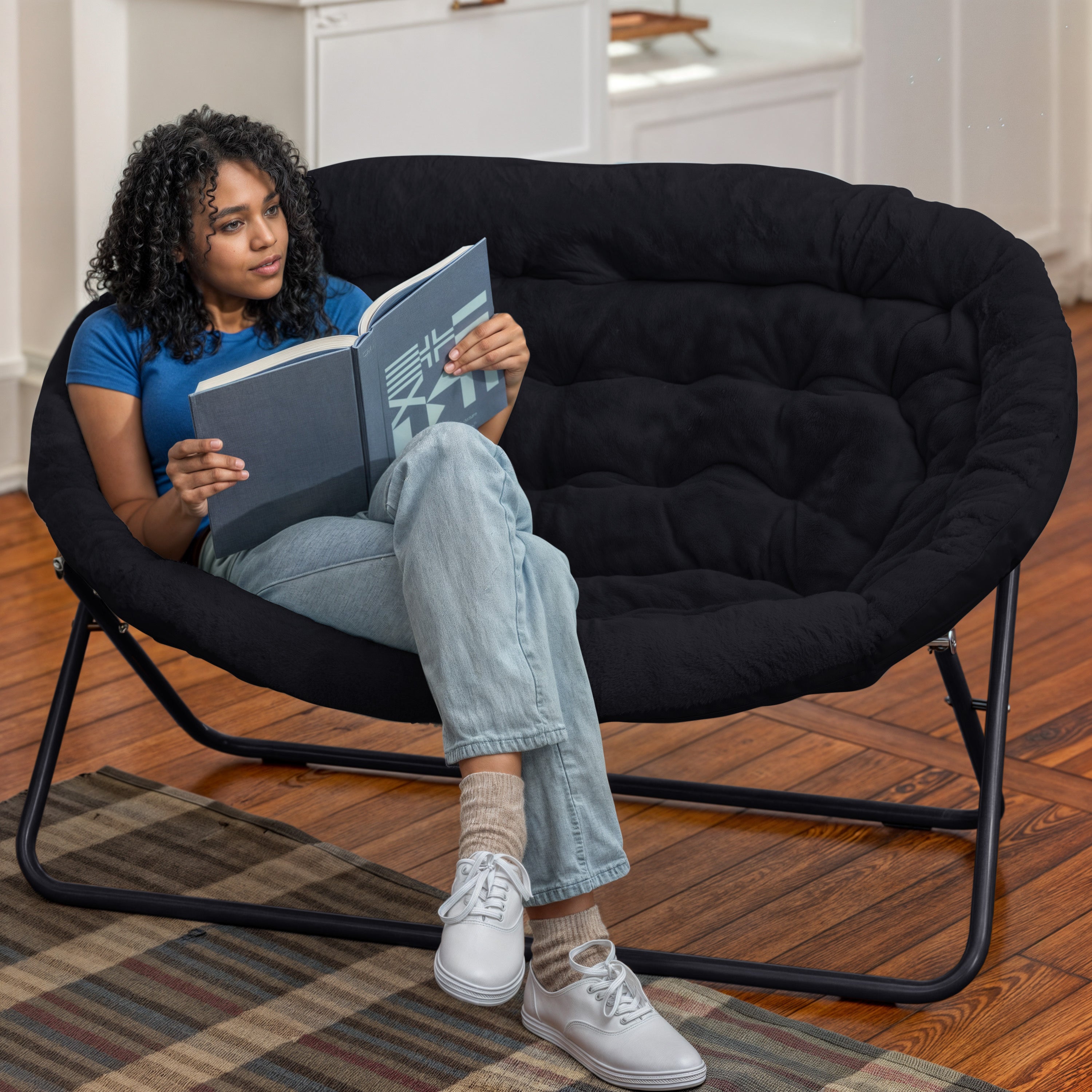 Eleanor 56" Portable Folding Double Saucer Chair in Black Faux Fur with a Black Steel Frame for Dorm, Living Room, or Bedroom