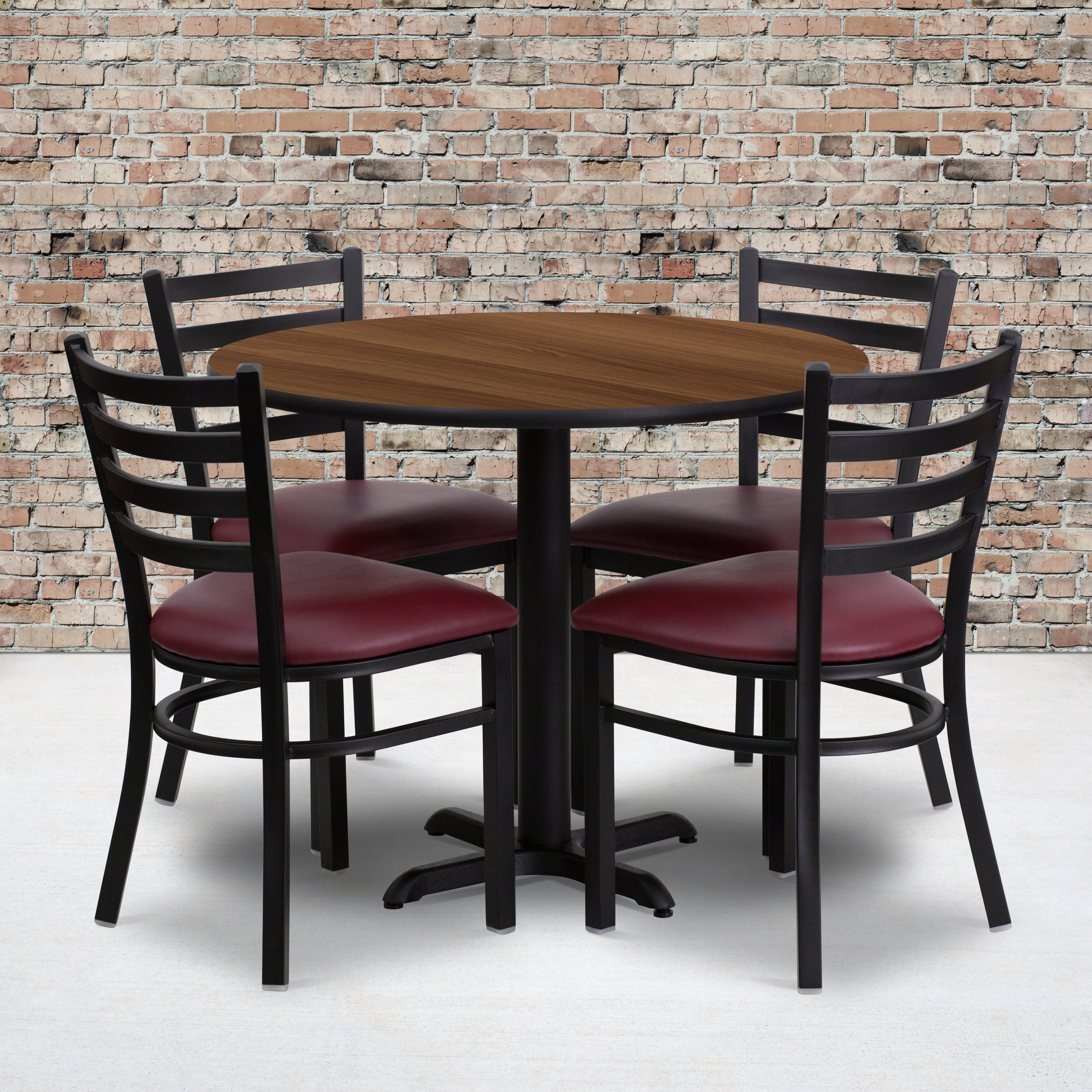 Carlton 36'' Round Walnut Laminate Table Set with X-Base and 4 Ladder Back Metal Chairs - Burgundy Vinyl Seat