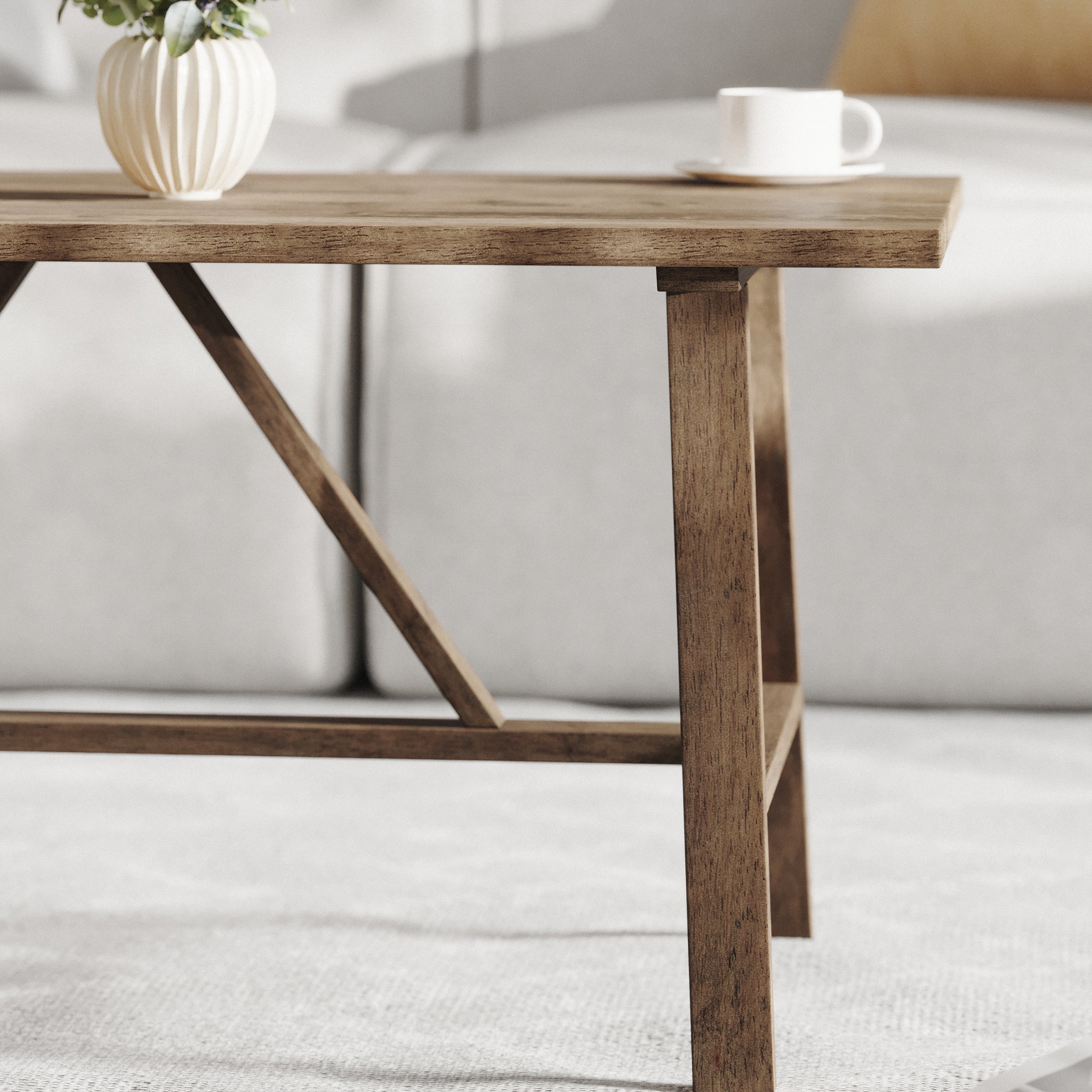 Eli Solid Wood Farmhouse Coffee Table, Trestle Style Accent Table in Rustic Brown