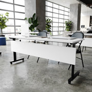 Palmer Commercial Grade 72" x 24" Heavy-Duty Nesting Flip Training Table with T-Legs, Modesty Panel, 1" Thick White Tabletop, and Black Steel Frame