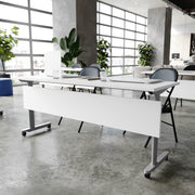 Palmer Commercial Grade 72" x 24" Heavy-Duty Nesting Flip Training Table with T-Legs, Modesty Panel, 1" Thick White Tabletop, and Gray Steel Frame