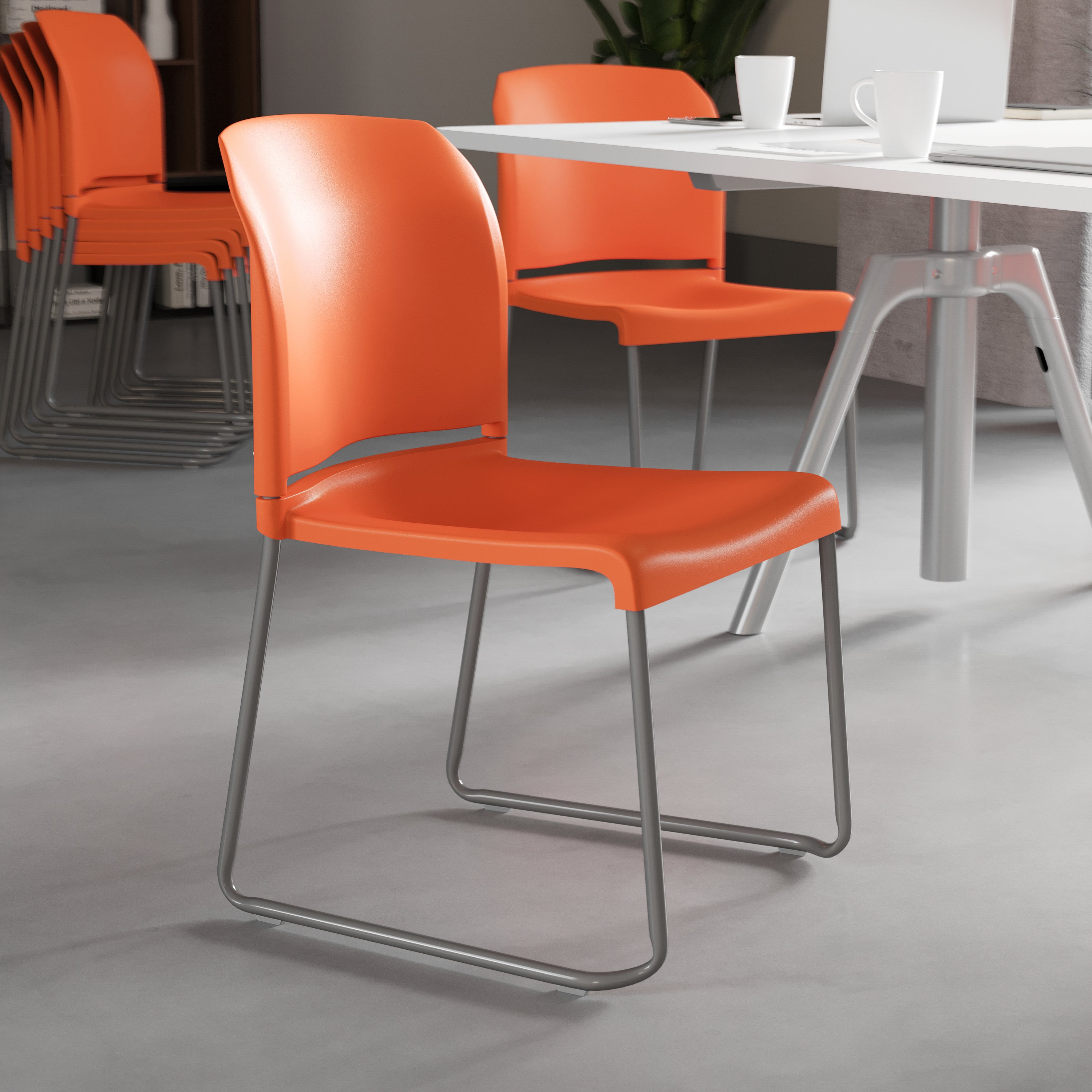HERCULES Series 880 lb. Capacity Orange Full Back Contoured Stack Chair with Gray Powder Coated Sled Base