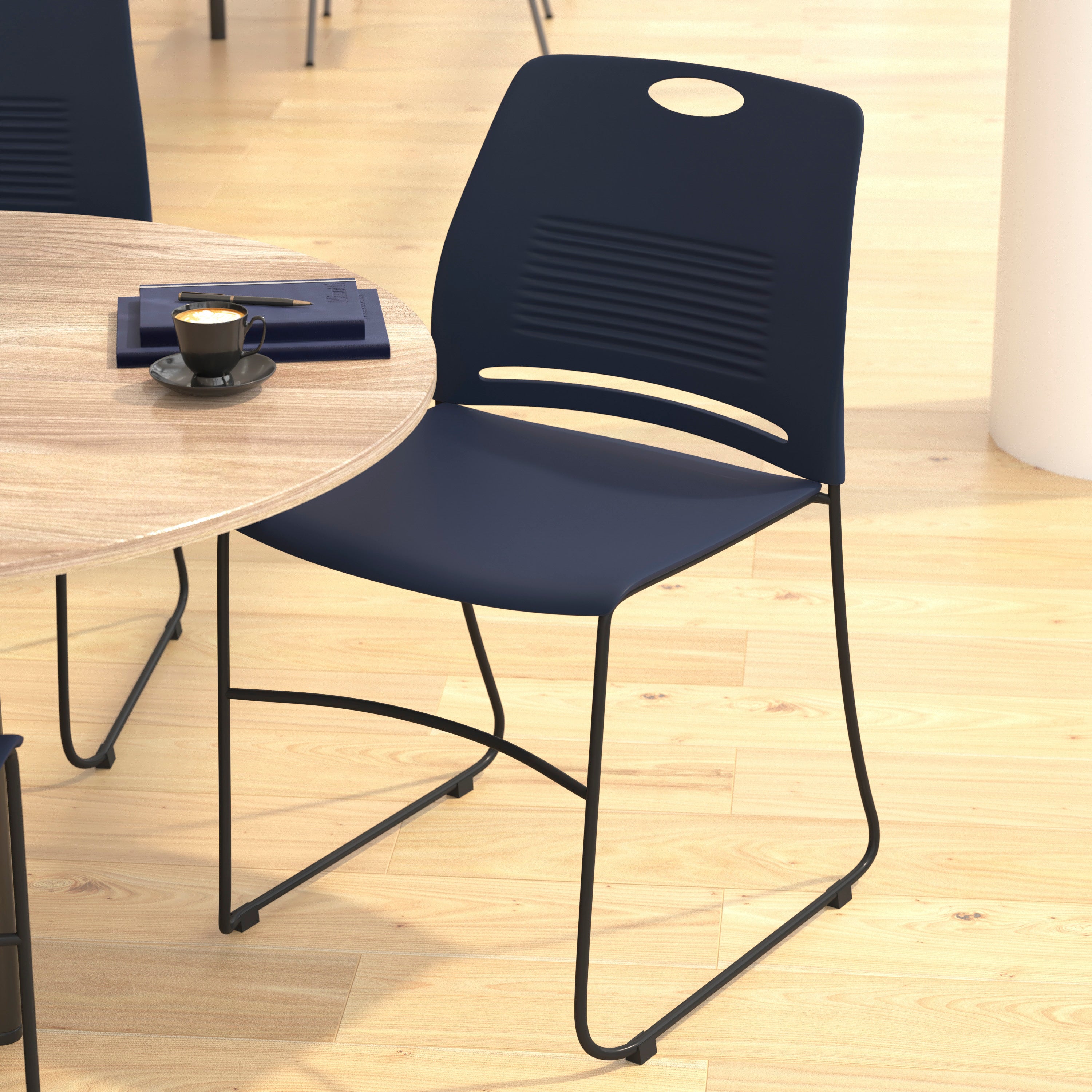 HERCULES Series Commercial Grade 660 lb. Capacity Navy Plastic Stack Chair with Black Powder Coated Sled Base Frame and Integrated Carrying Handle