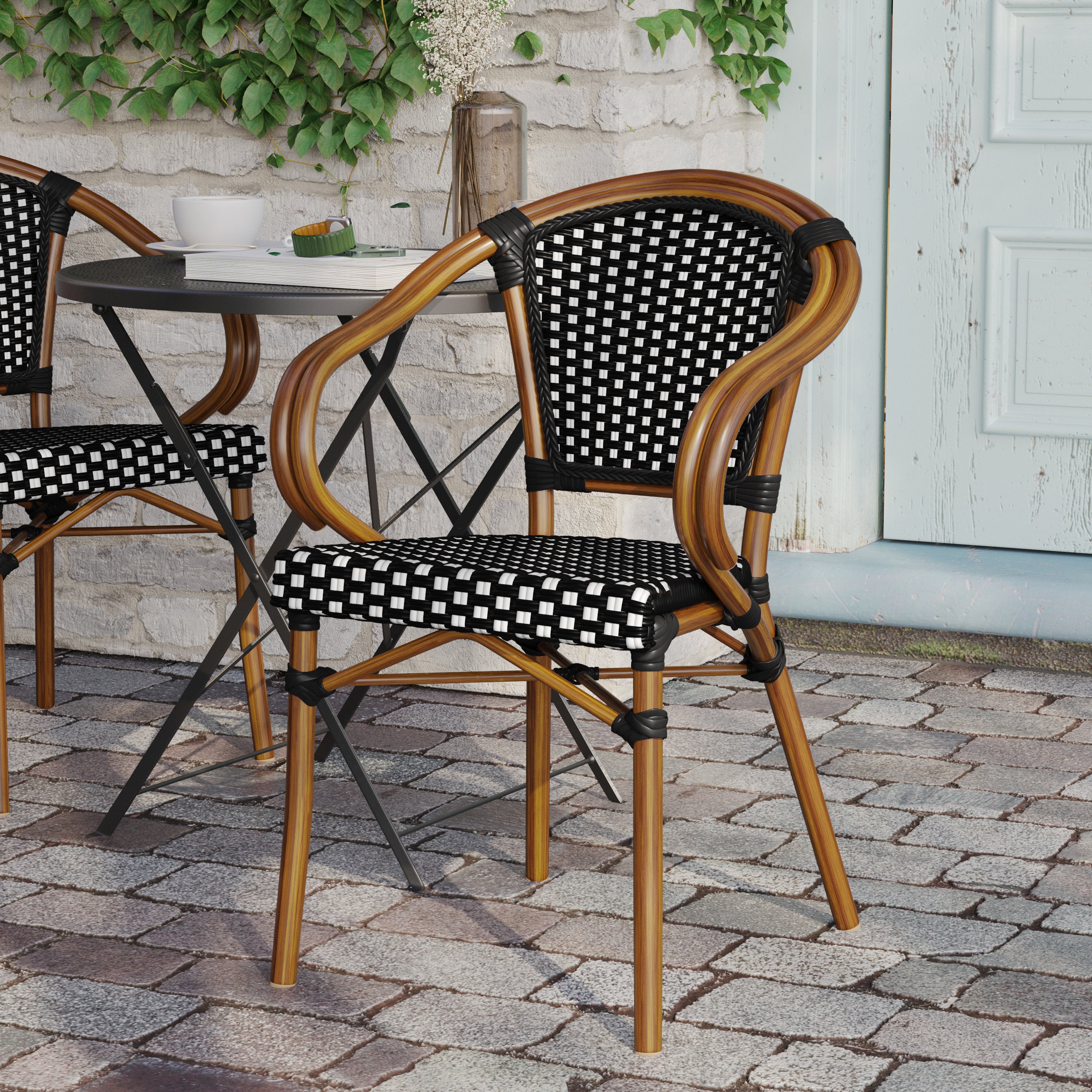 Bordeaux Indoor/Outdoor Commercial Bistro Stacking Chair with Arms, Black and White PE Rattan and Bamboo Print Aluminum Frame in Natural