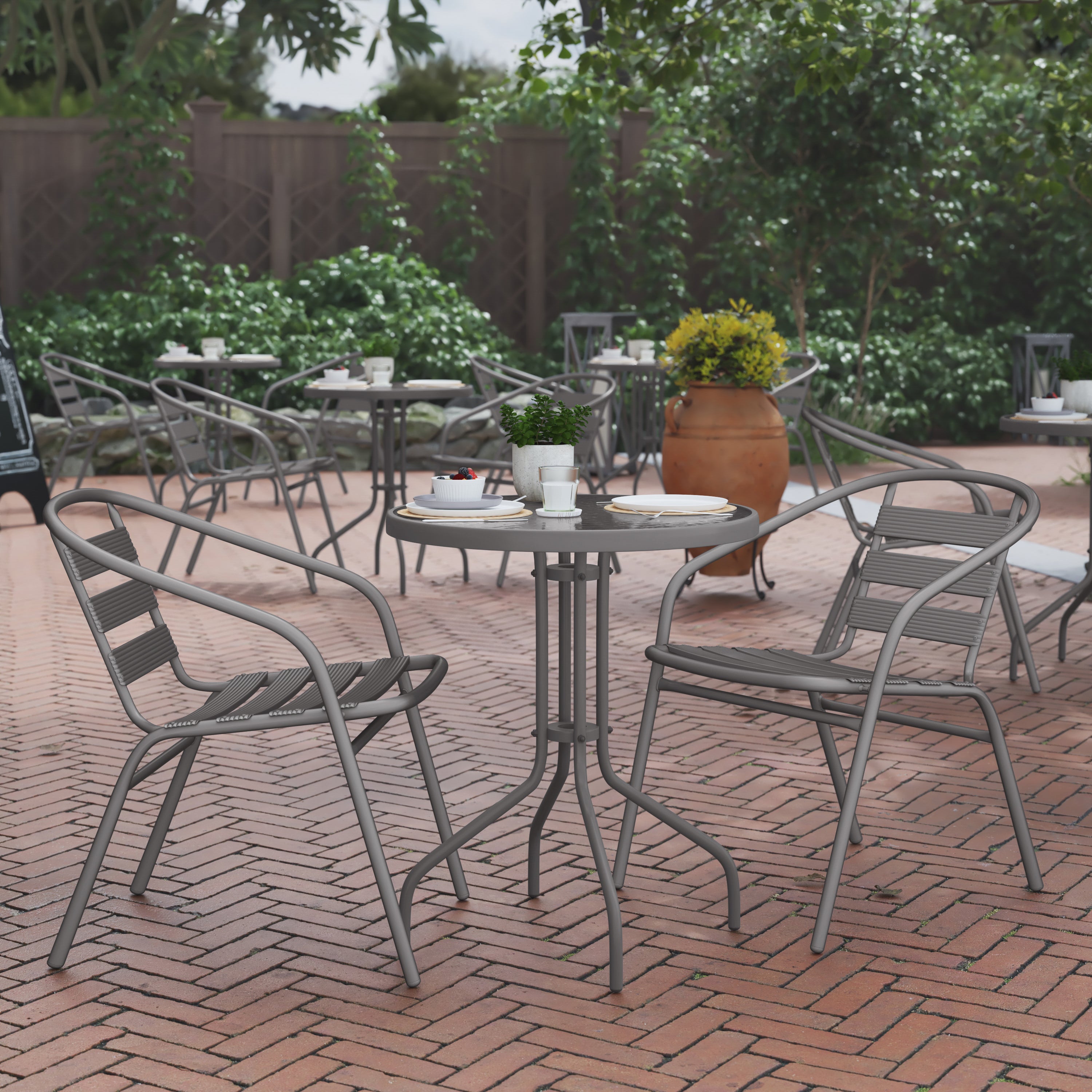 Lila 23.75'' Round Glass Top Metal Table with 2 Silver Aluminum Slat Stack Chairs