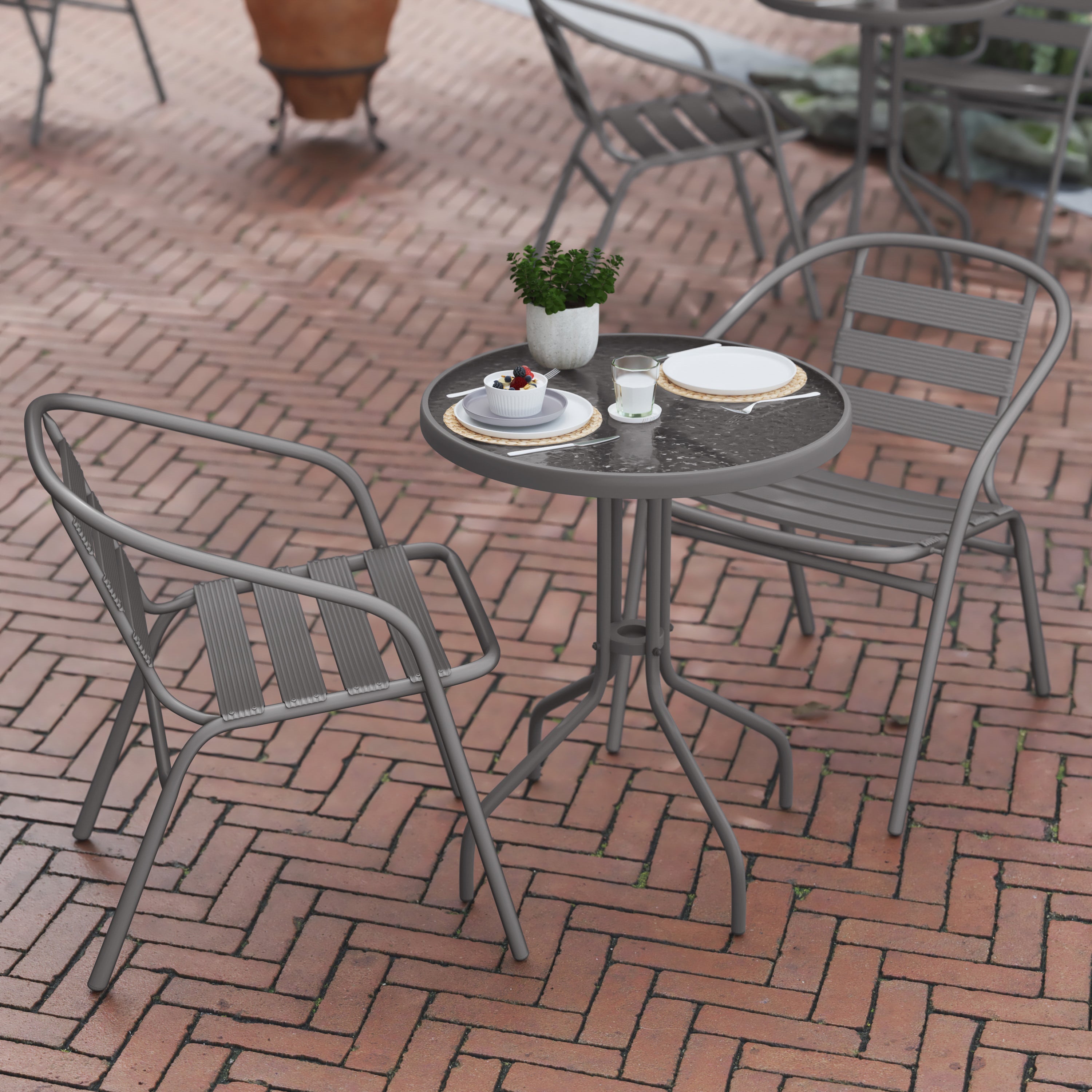 Lila 23.75'' Round Glass Top Metal Table with 2 Silver Aluminum Slat Stack Chairs