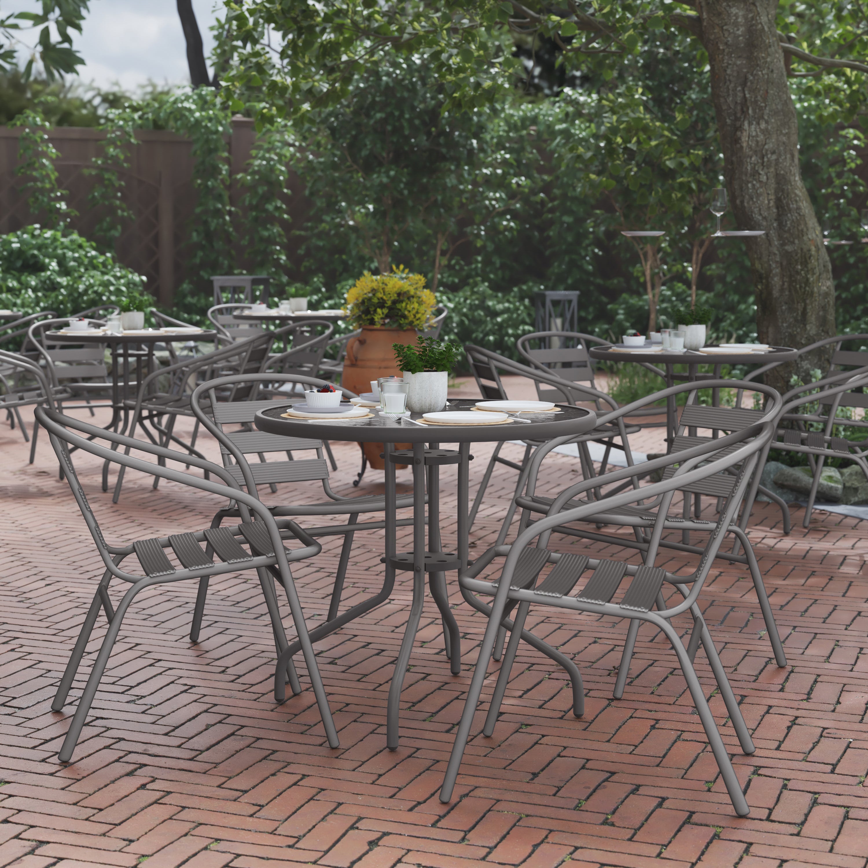 Lila 31.5'' Round Glass Top Metal Table with 4 Silver Aluminum Slat Stack Chairs