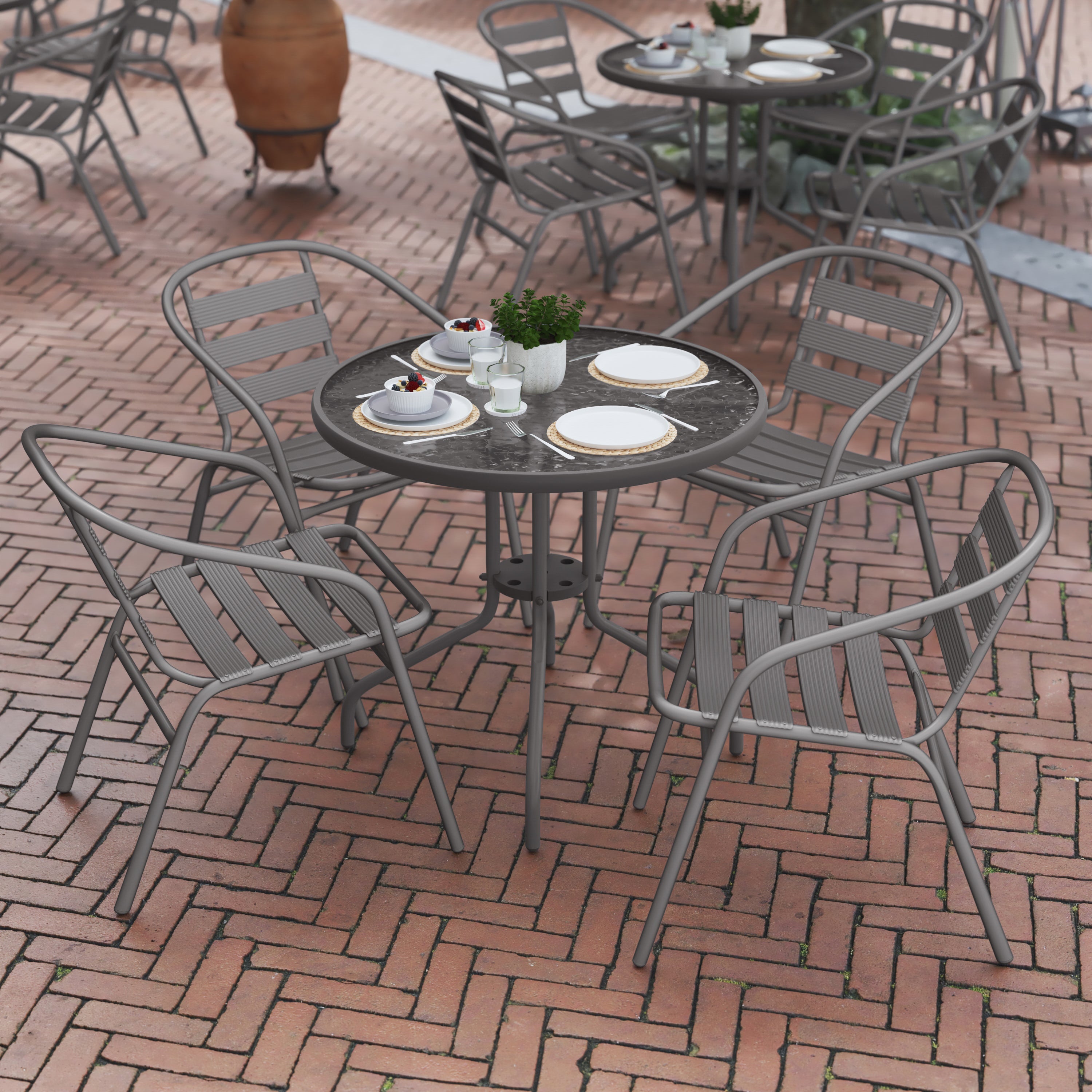 Lila 31.5'' Round Glass Top Metal Table with 4 Silver Aluminum Slat Stack Chairs