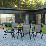 Brazos 7 Piece Outdoor Patio Dining Set - 55" Tempered Glass Patio Table with Umbrella Hole, 6 Gray Flex Comfort Stack Chairs