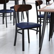 Wright Commercial Dining Chair with 500 LB. Capacity Black Steel Frame, Walnut Finish Wooden Boomerang Back, and Blue Vinyl Seat