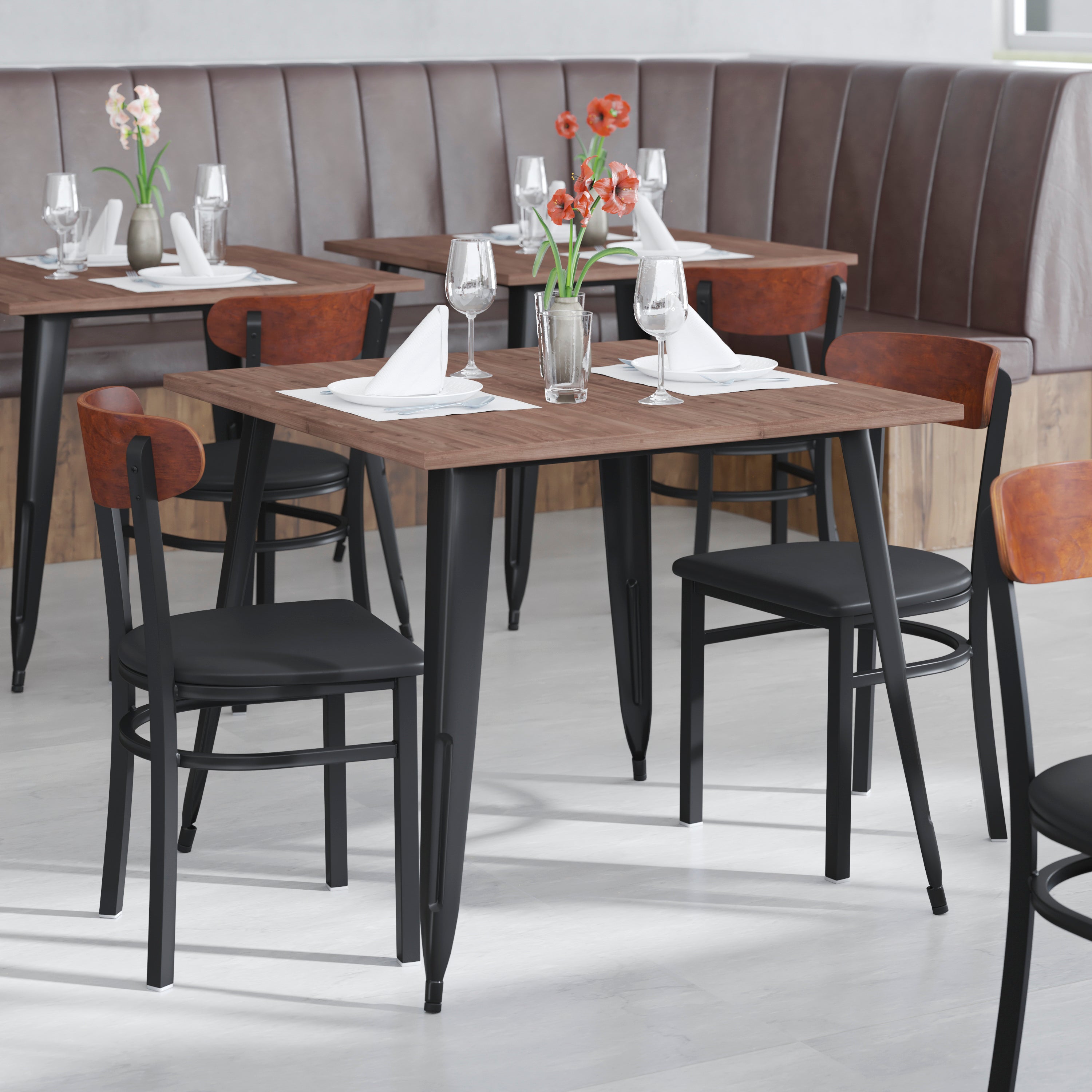 Wright Commercial Dining Chair with 500 LB. Capacity Black Steel Frame, Walnut Finish Wooden Boomerang Back, and Black Vinyl Seat