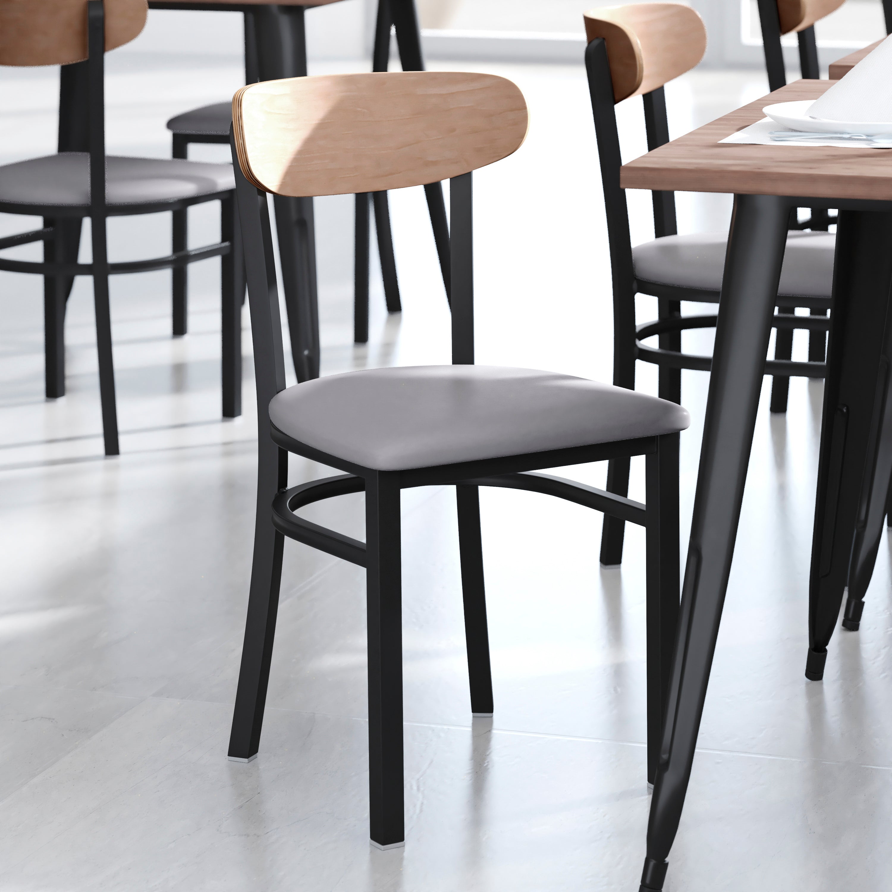 Wright Commercial Dining Chair with 500 LB. Capacity Black Steel Frame, Natural Birch Finish Wooden Boomerang Back, and Gray Vinyl Seat