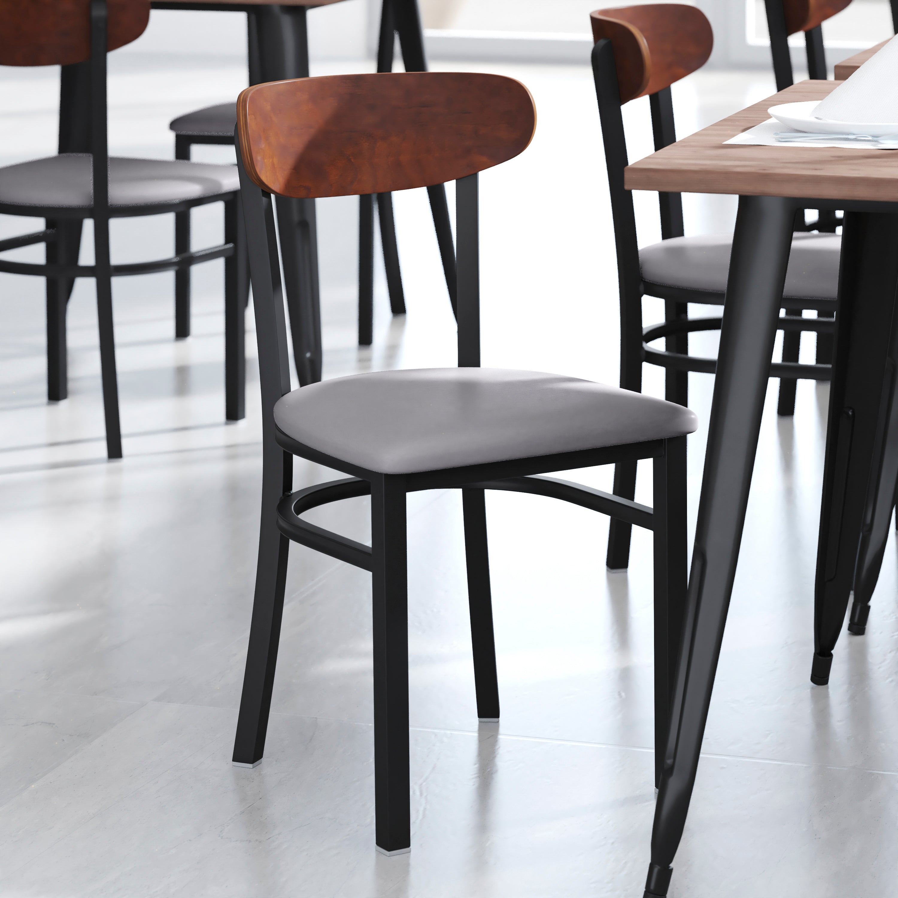 Wright Commercial Dining Chair with 500 LB. Capacity Black Steel Frame, Walnut Finish Wooden Boomerang Back, and Gray Vinyl Seat