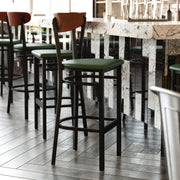 Wright Commercial Barstool with 500 LB. Capacity Black Steel Frame, Walnut Finish Wooden Boomerang Back, and Green Vinyl Seat