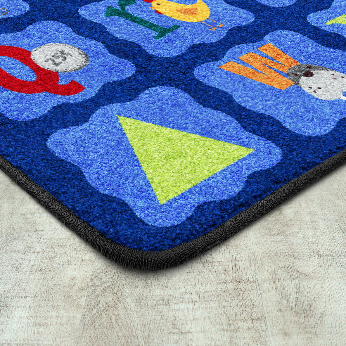 Alphabet Blues 7'8" x 10'9" area rug in color Multi
