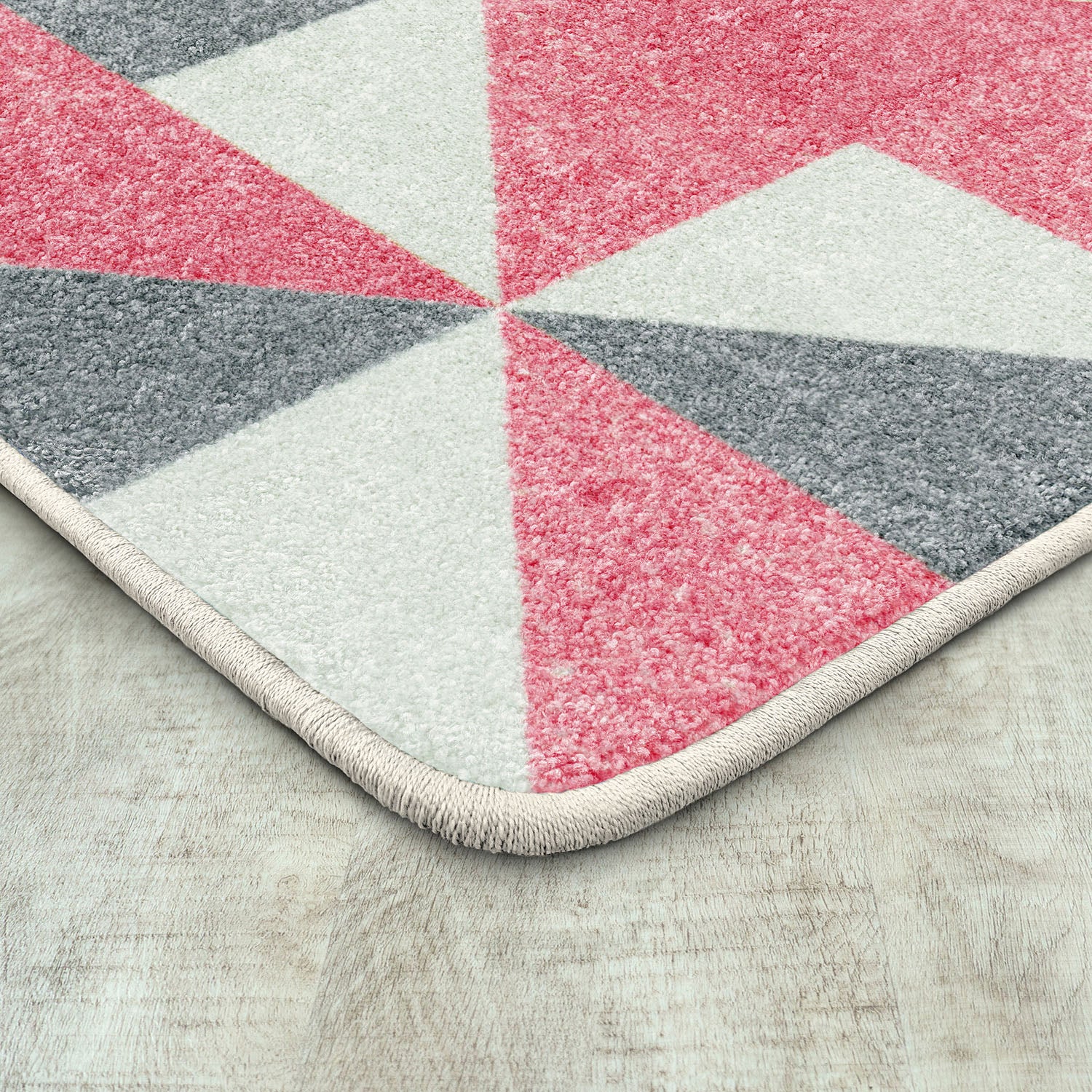 Cartwheel 5'4" x 7'8" area rug in color Blush
