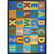 Oversize Alphabet 5'4" x 7'8" area rug in color Earthtone
