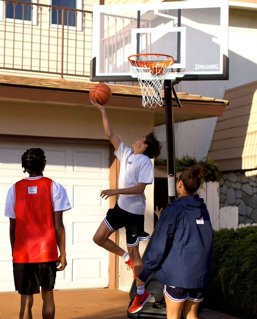 Spalding 54" Glass Ultimate Hybrid Portable Basketball Hoop