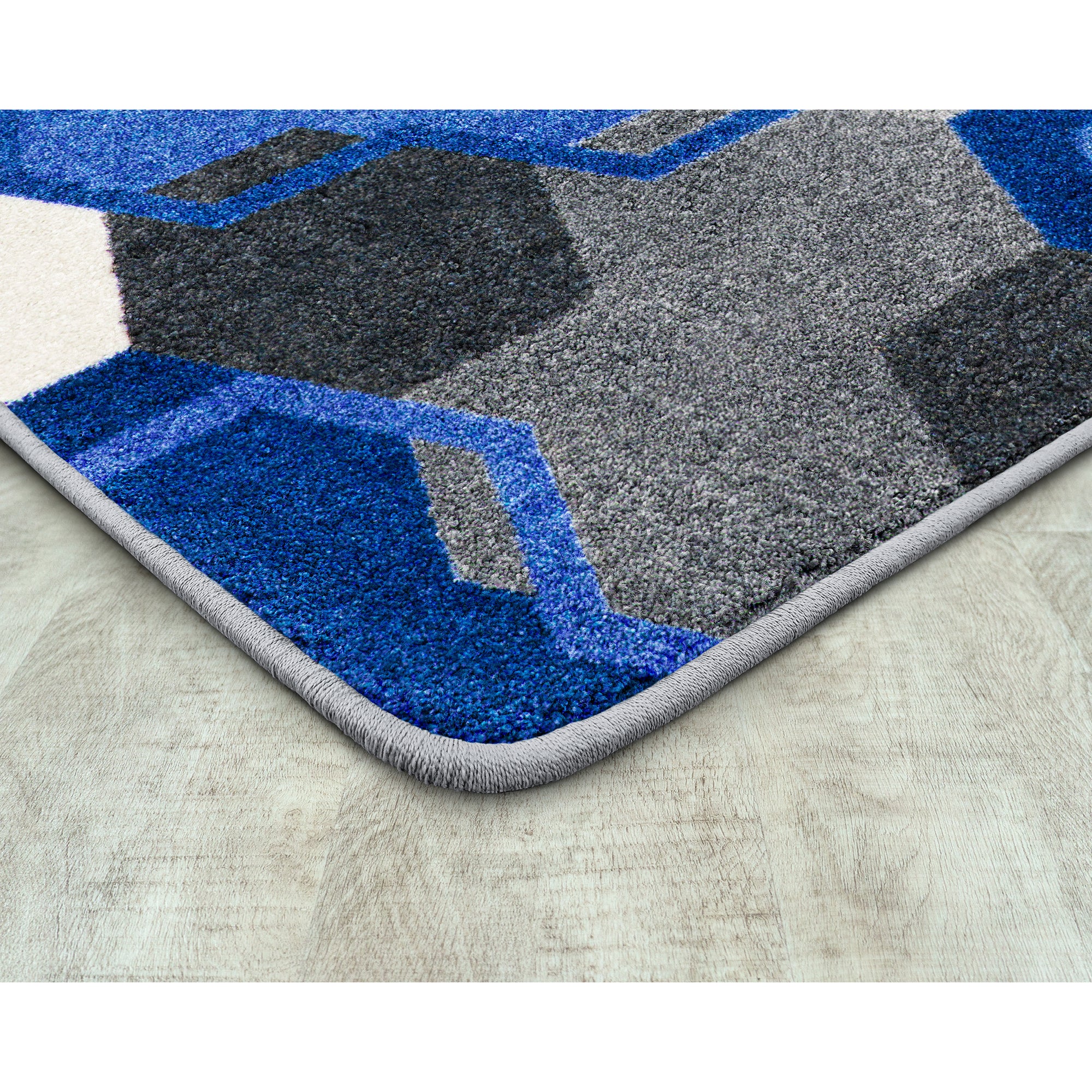 Team Up 5'4" x 7'8" area rug in color Blue